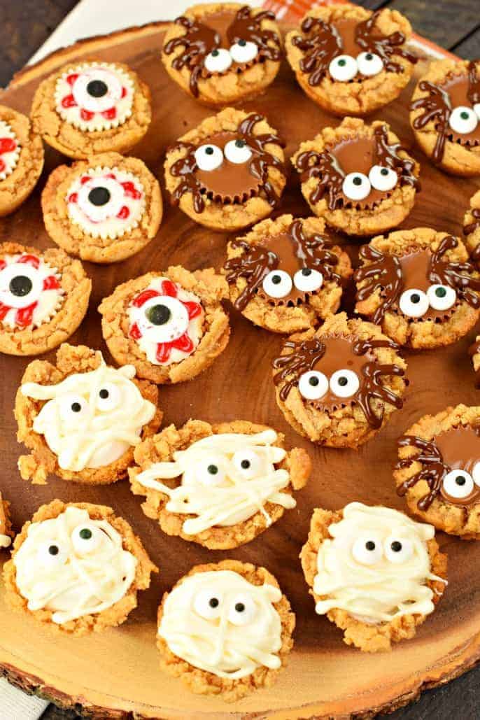 Peanut butter cookie cups with toppings to look like eyeballs, spiders, and mummies for Halloween.