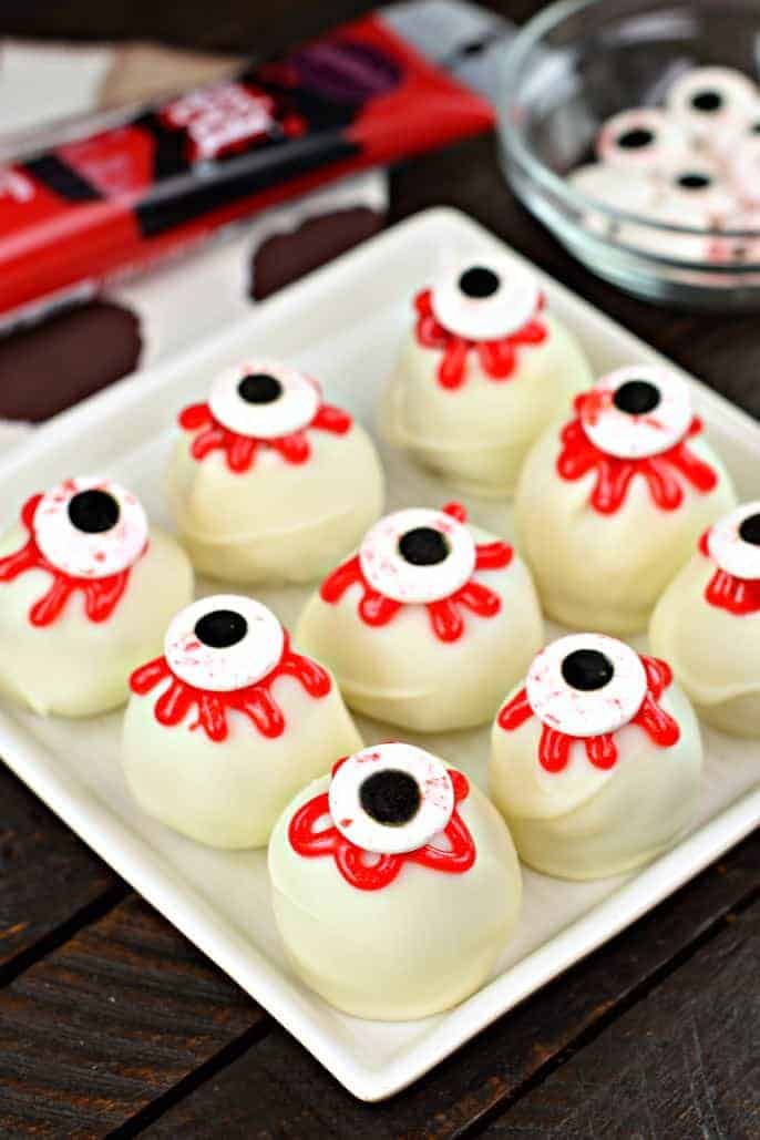 Red velvet cake balls with spooky eyes for halloween.
