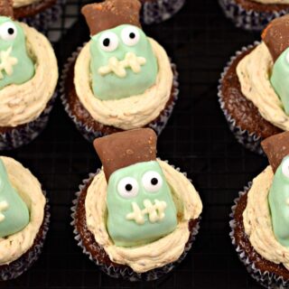Chocolate cupcakes with butterfinger frosting and decorated with a frankenstein candy.