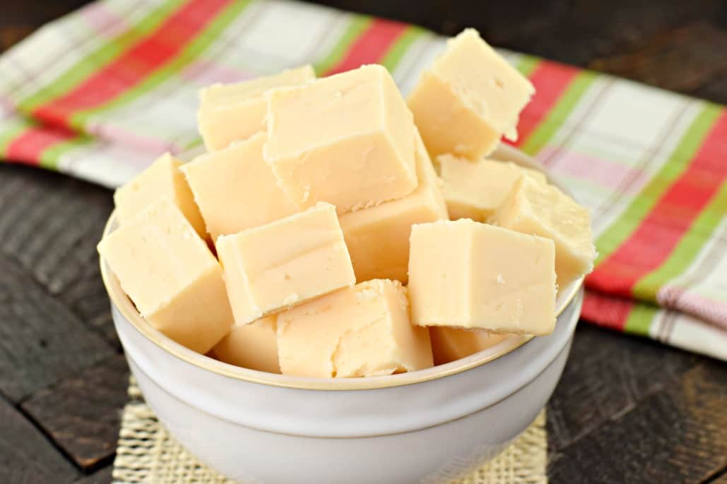 White bowl with pieces of butter rum fudge candy.