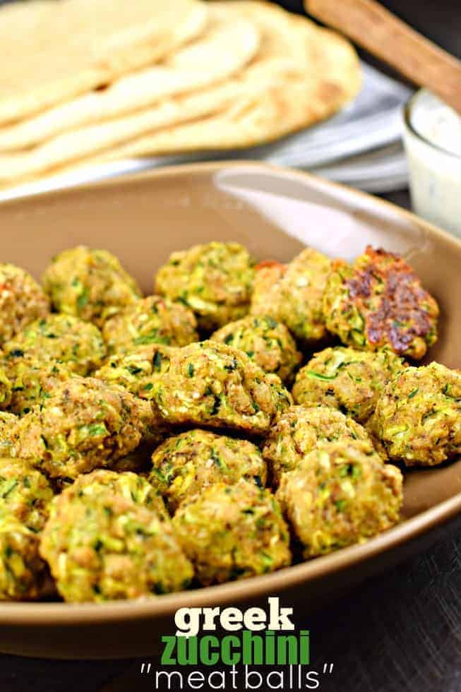 Brown bowl with meatleass meatballs made with zucchini and greek seasoning.