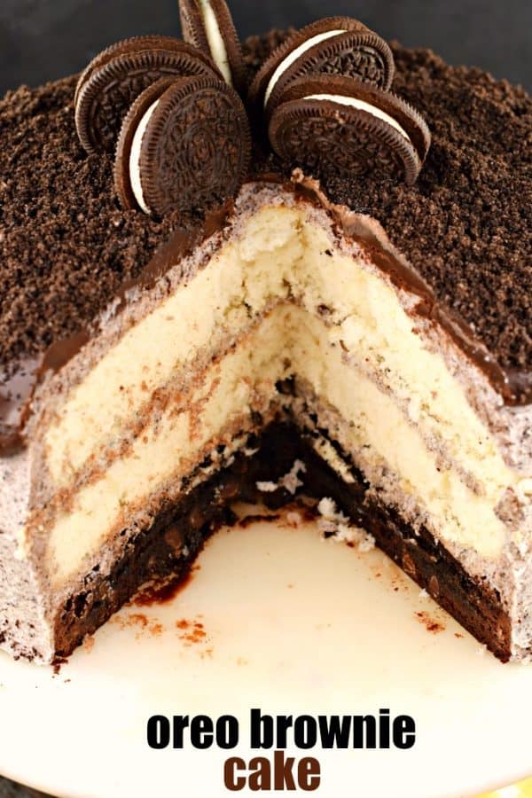 Oreo Brownie Cake with three layers. One layer of brownie, two white cake and topped with oreo frosting and ganache.