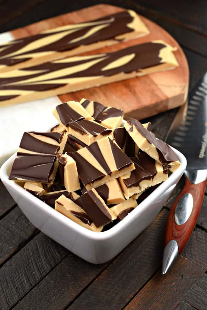 Tiger Butter Fudge #swirled #chocolate #peanutbutter #candy #confections Chocolate peanut butter fudge in a white bowl.