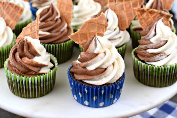 CHOCOLATE VANILLA SWIRLED FROSTING on a CHOCOLATE CUPCAKE in a green and blue wrappers with a WAFFLE CONE, CHOCOLATE, BUTTERCREAM FROSTING, FROM SCRATCH