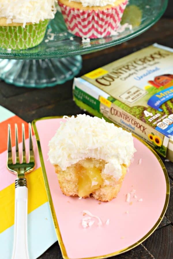 Lemon Curd filled Coconut Cupcake on plate