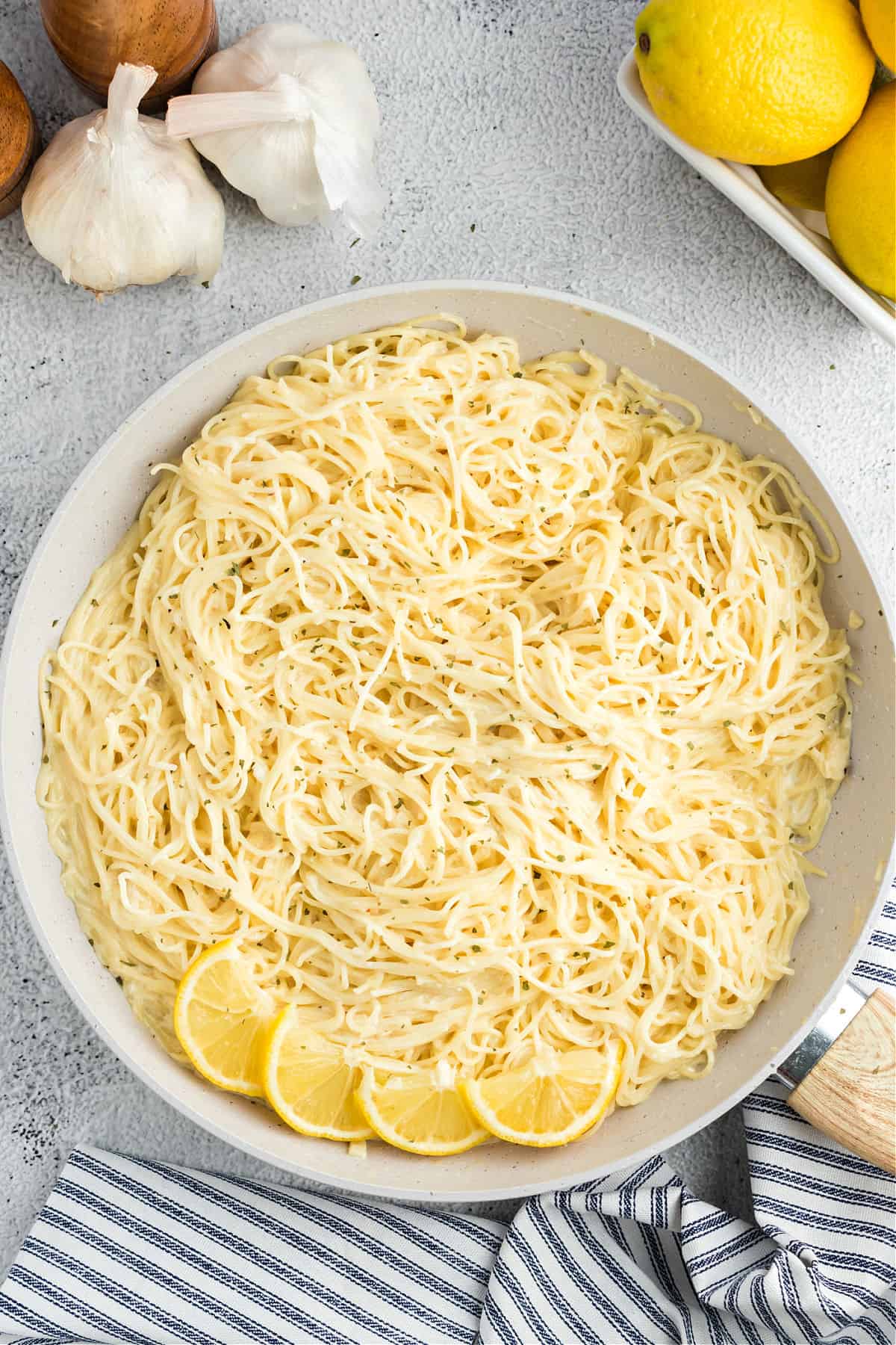 Lemon garlic pasta in a big white serving bowl.