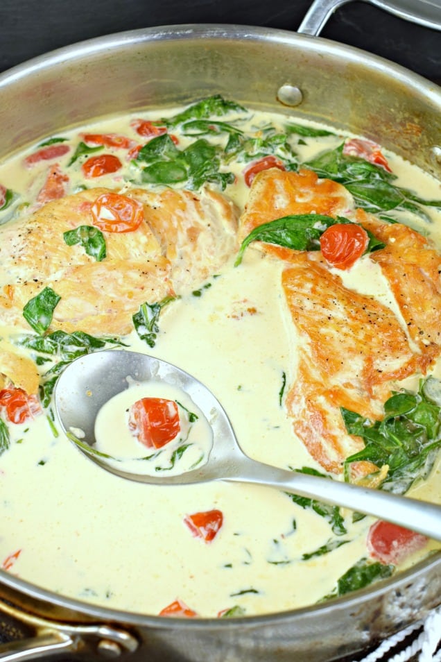 Chicken in creamy tuscan garlic sauce with spinach and tomatoes.
