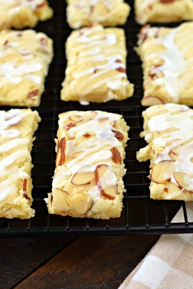 Almond bars on a black wire rack.