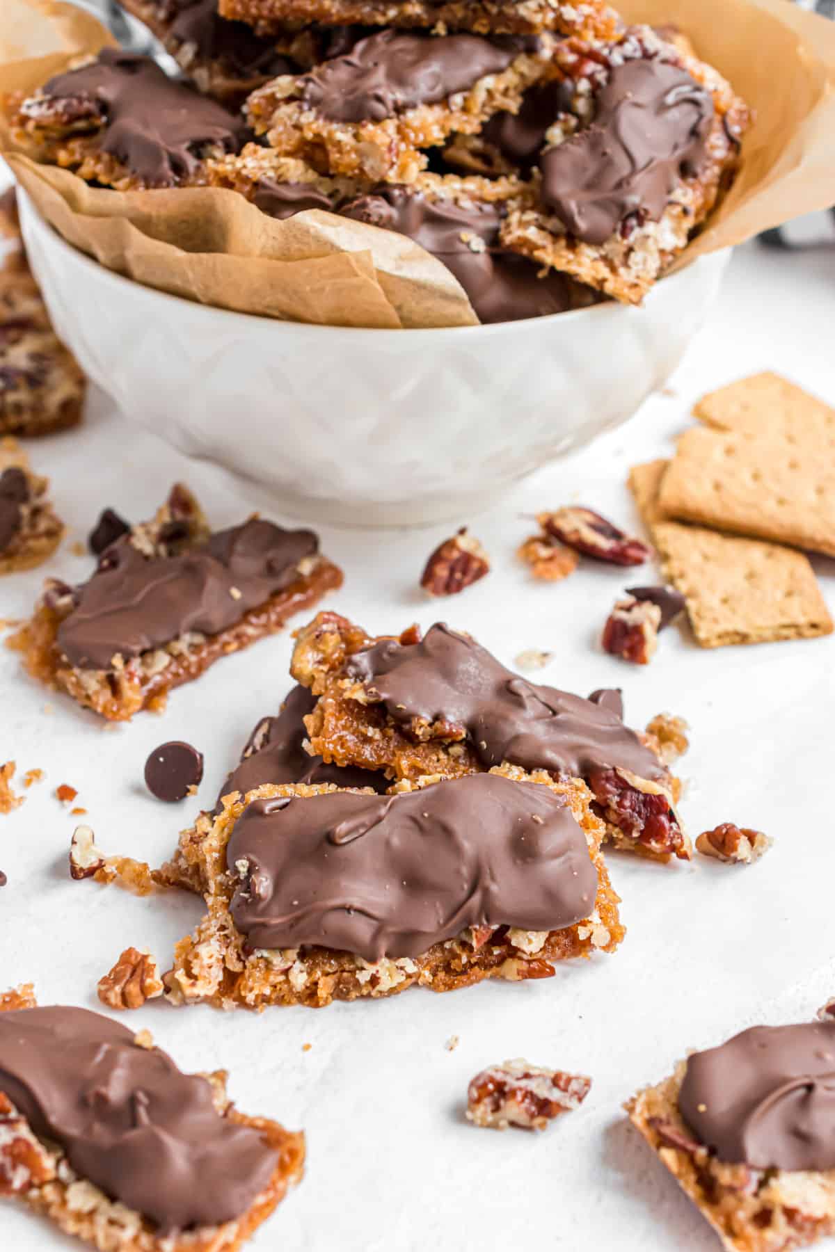 Graham cracker toffee bars on counter, with some in a bowl.