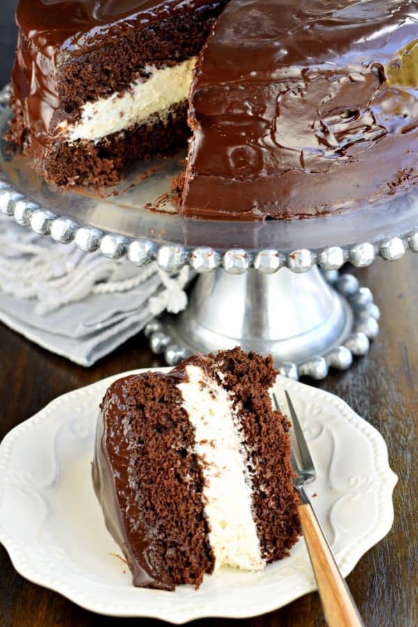 This Copycat Hostess Ding Dong Cake recipe is a rich, decadent chocolate cake, with a creamy filling and chocolate ganache spread over the top!
