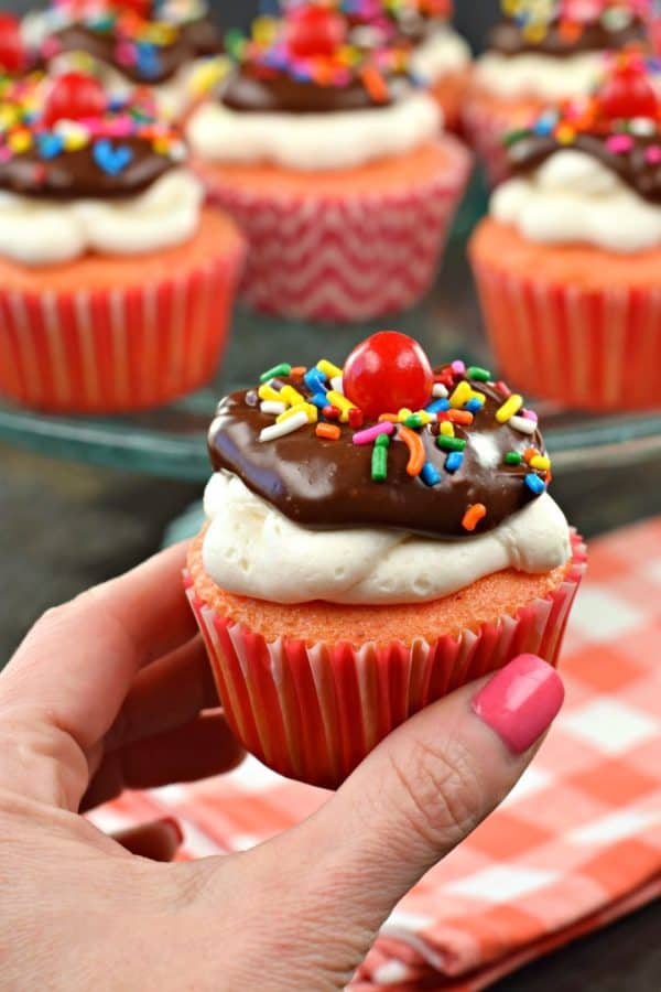 Strawberry Cupcakes topped with vanilla frosting and chocolate ganache