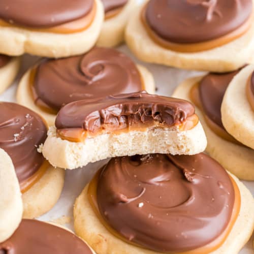 These Twix cookies have a buttery shortbread cookie base with creamy caramel and chocolate on top! I'm not even kidding when I say they are addictive!