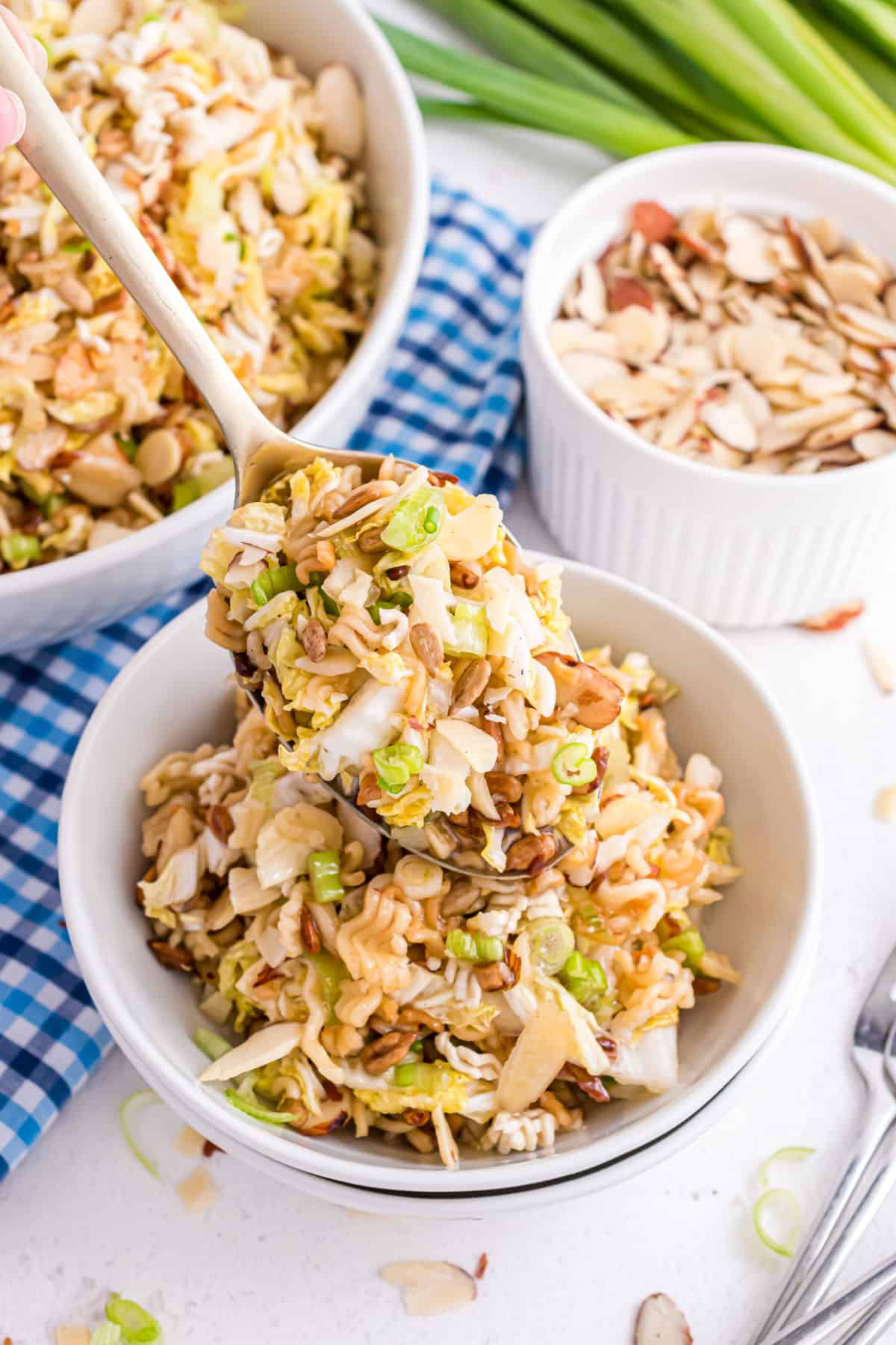 Ramen coleslaw with a serving spoon.