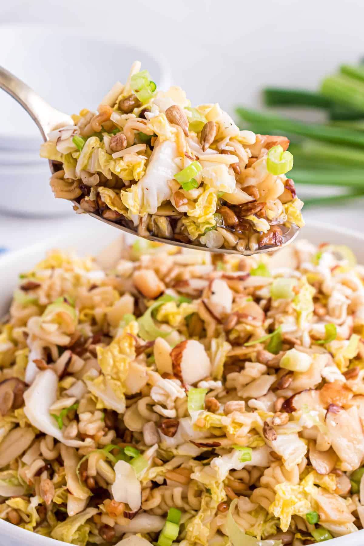 Chinese coleslaw with a spoonful being taken out of dish.