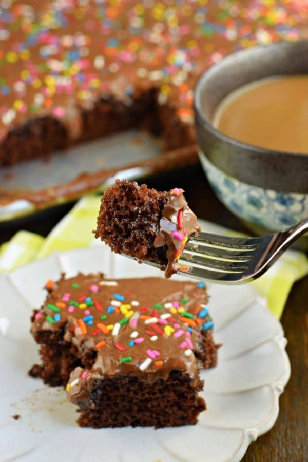 Easy one bowl Chocolate Buttermilk Sheet Cake recipe. Fudgy buttermilk frosting on top! Perfect for a crowd, or freeze for later.