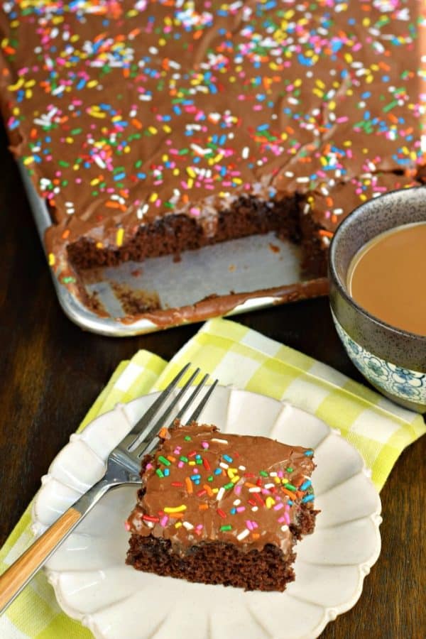 Easy one bowl Chocolate Buttermilk Sheet Cake recipe. Fudgy buttermilk frosting on top! Perfect for a crowd, or freeze for later.