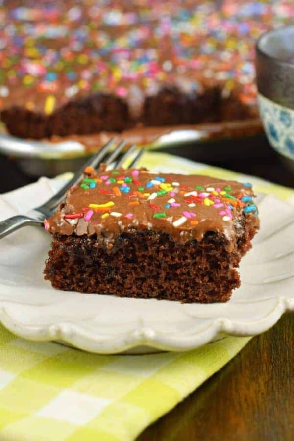 Easy one bowl Chocolate Buttermilk Sheet Cake recipe. Fudgy buttermilk frosting on top! Perfect for a crowd, or freeze for later. #chocolate #sheetcake #chocolatecake #cake
