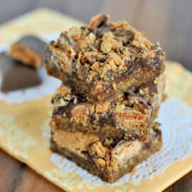 Butterfinger Fudge Cookie Bars are peanut butter cookies, topped with a soft chocolate fudge layer and crushed Butterfingers. A decadent combo of sweet, nutty, crunchy flavors no one can resist!