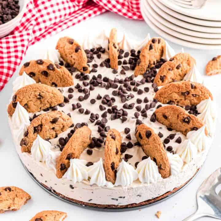 This easy, no bake Chocolate Chip Cookie Cheesecake recipe is the perfect summer treat. Cookie crust with creamy cheesecake filling, it's so decadent and delicious!