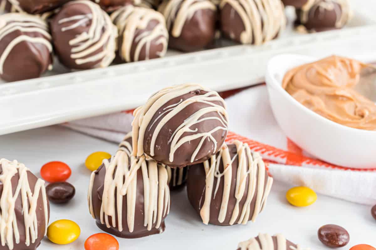 Stack of cookie dough balls dipped in chocolate.