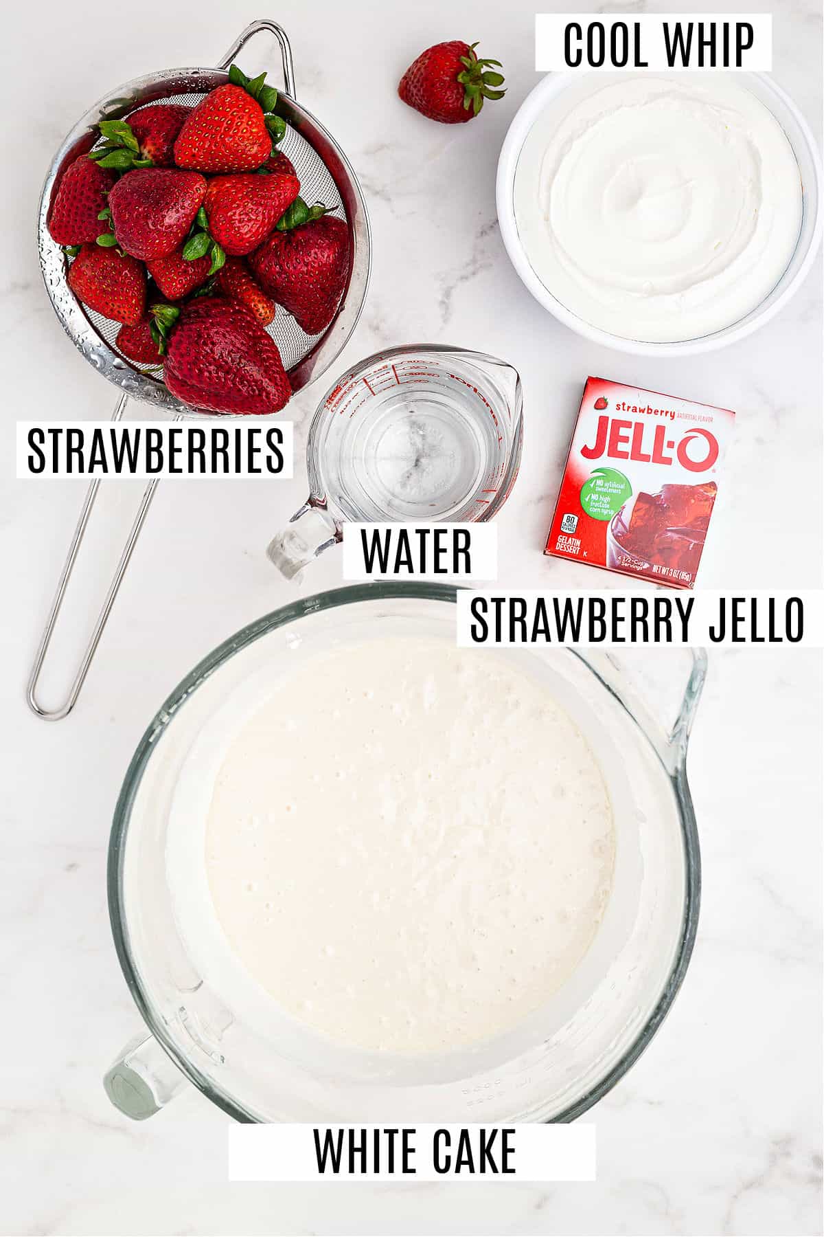Strawberry jello cake ingredients on counter.