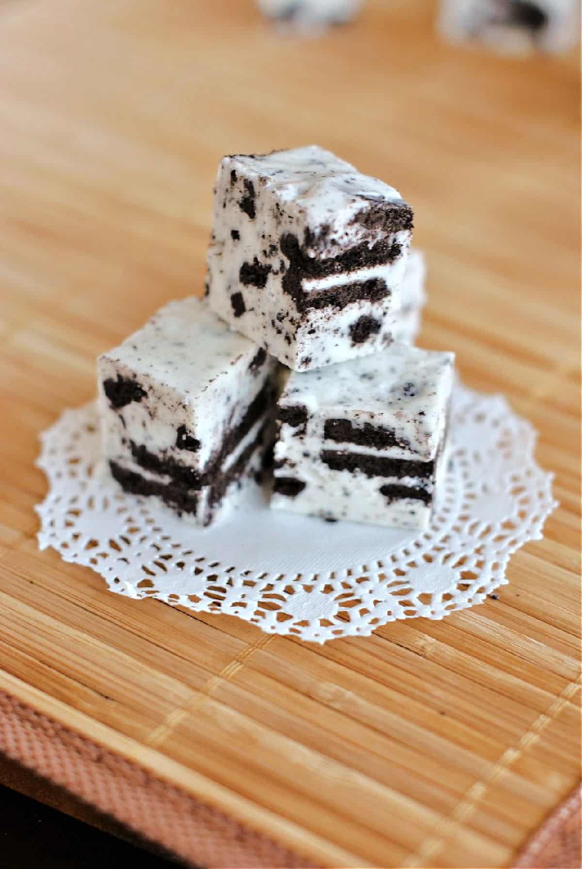 Stack of three pieces of oreo fudge.