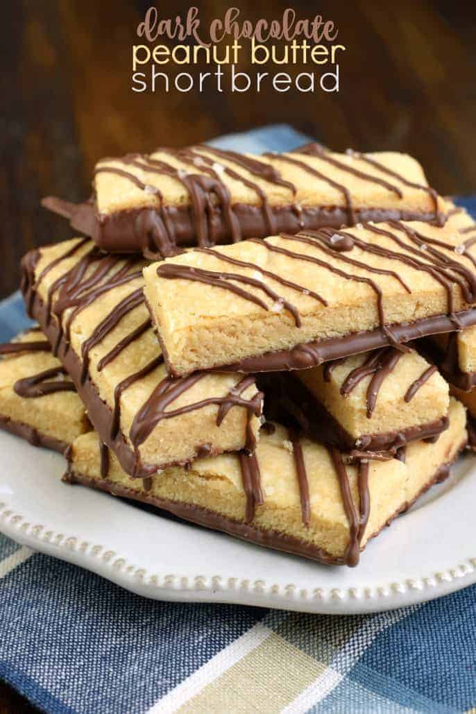 Stack of peanut butter shortbread cookies with chocolate drizzle.