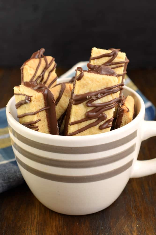 Peanut butter and chocolate shortbread cookies in a mug.