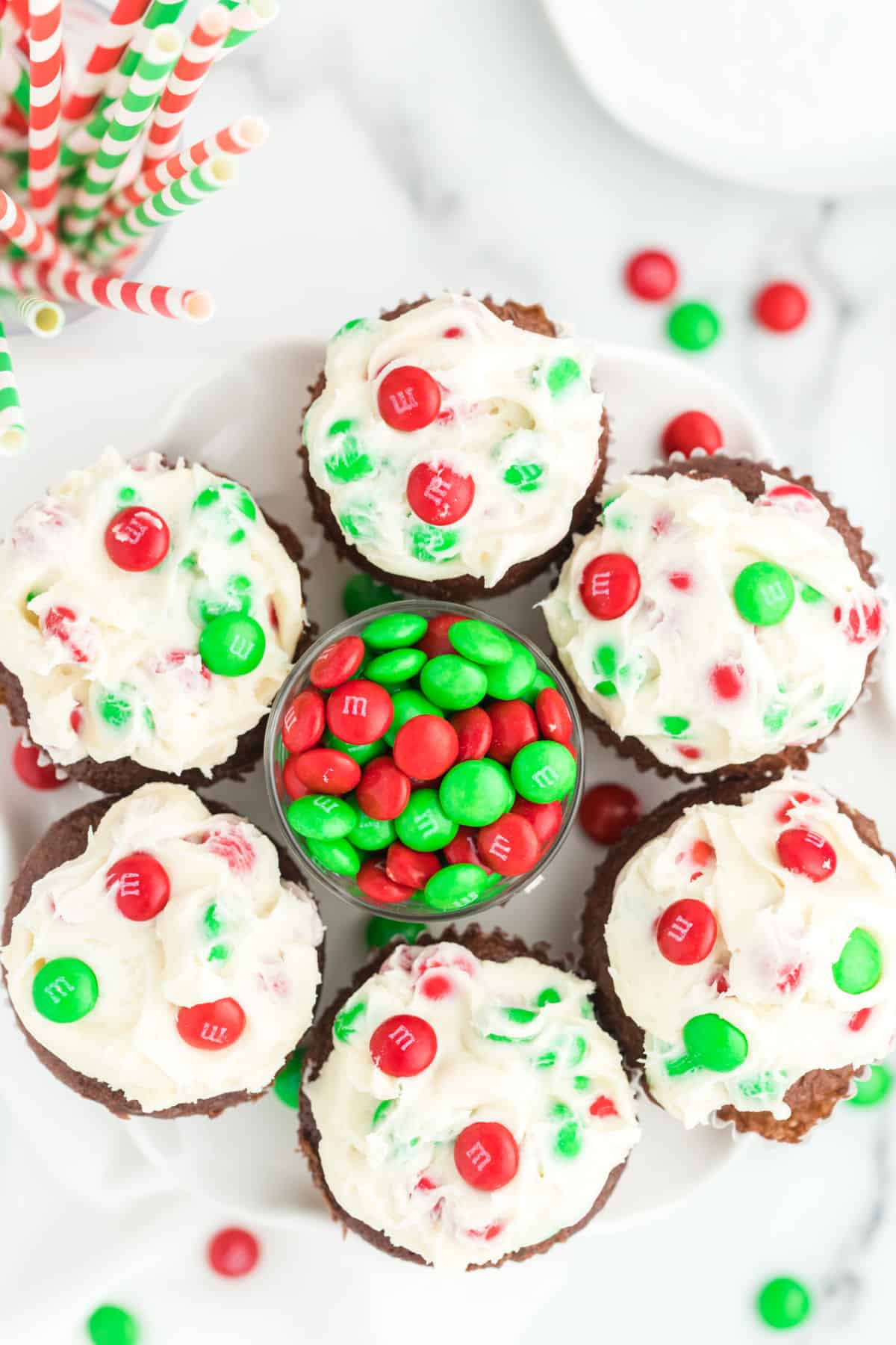 Holiday frosted chocolate cupcakes with m&ms.