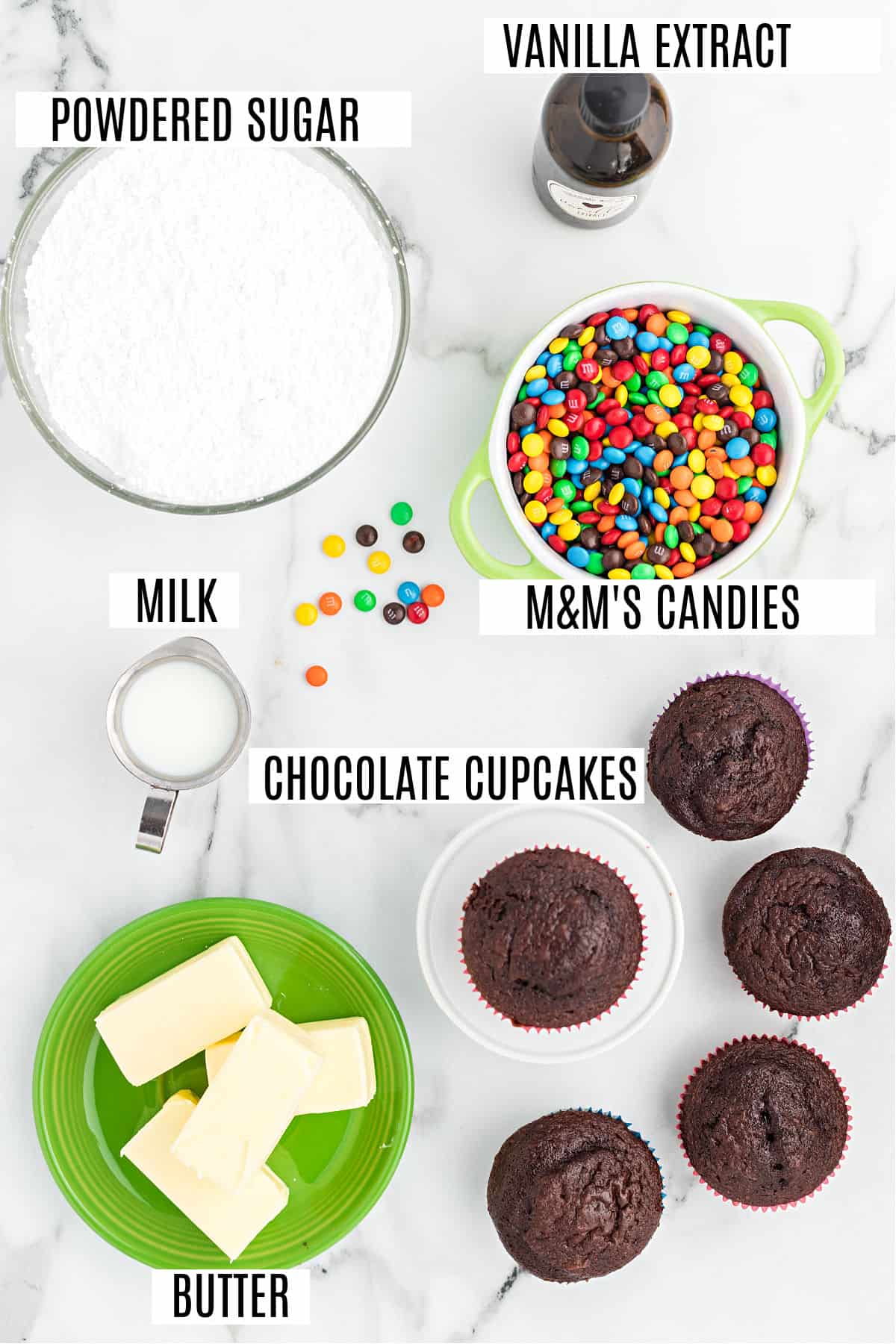 Ingredients for chocolate cupcakes with M&M frosting.