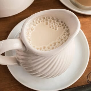 Homemade coffee creamer in a white pitcher.
