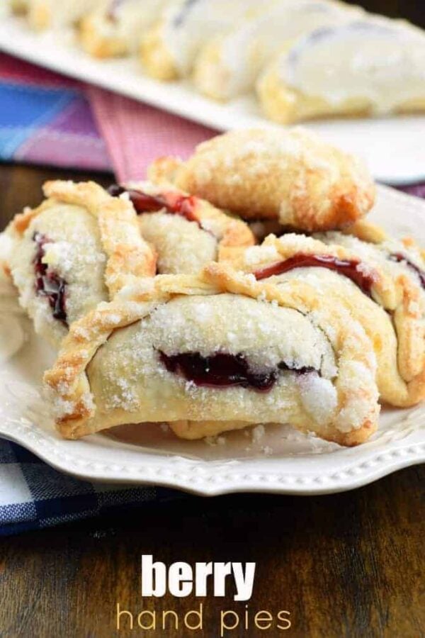 Combining strawberry and blueberry pie filling results in the most delicious, baked Berry Hand Pies. Perfect for summer, holidays, or anything in between! #handpies #summer #berries #berrypie #pie #baking Combining strawberry and blueberry pie filling results in the most delicious, baked Berry Hand Pies. Perfect for summer, holidays, or anything in between!