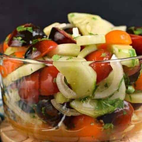 Healthy and light, this fresh Cucumber Tomato Salad is a delicious summer side dish!