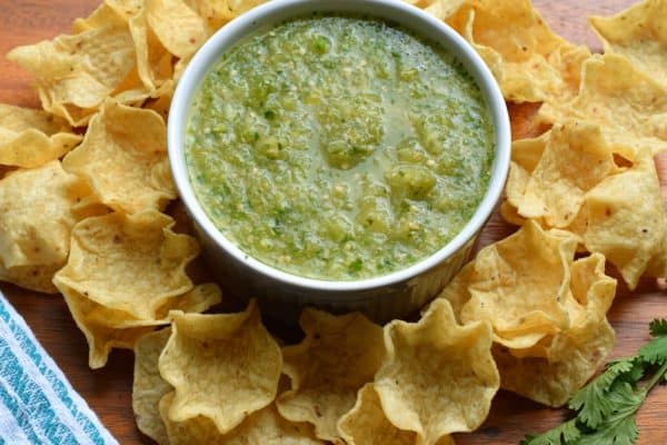 Try this Tomatillo Salsa recipe for an authentic, tangy Mexican salsa verde. Perfect for pairing with tacos, enchiladas or a big bowl of chips! #tomatillosalsa #salsaverde #gameday #tortillachips #snacks #salsa