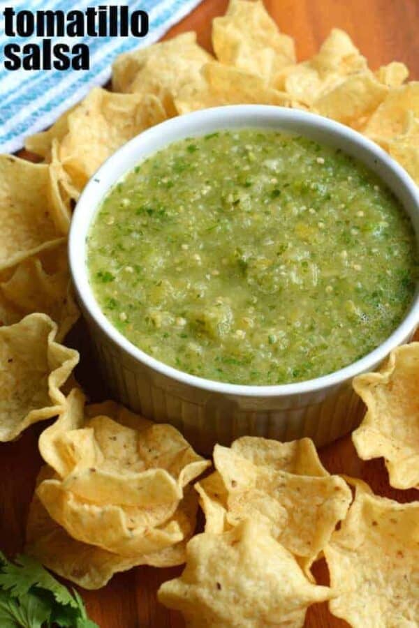 Try this Tomatillo Salsa recipe for an authentic, tangy Mexican salsa verde. Perfect for pairing with tacos, enchiladas or a big bowl of chips! #tomatillosalsa #salsaverde #gameday #tortillachips #snacks #salsa