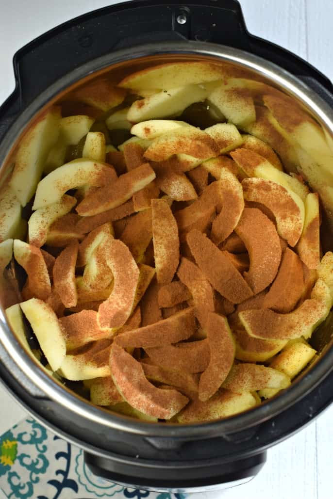 Sliced apples with cinnamon in instant pot.