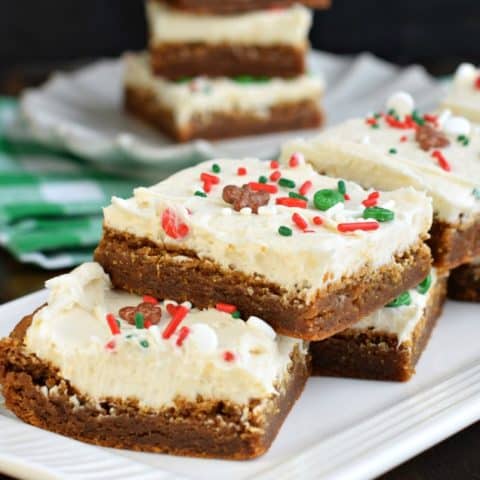 Gingerbread bars served on a white platter.