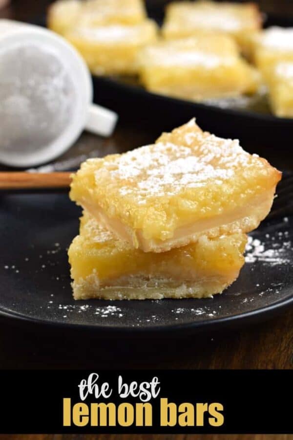 The Best Lemon Bars made with a shortbread crust and lemon filling. Topped with glaze AND powdered sugar.