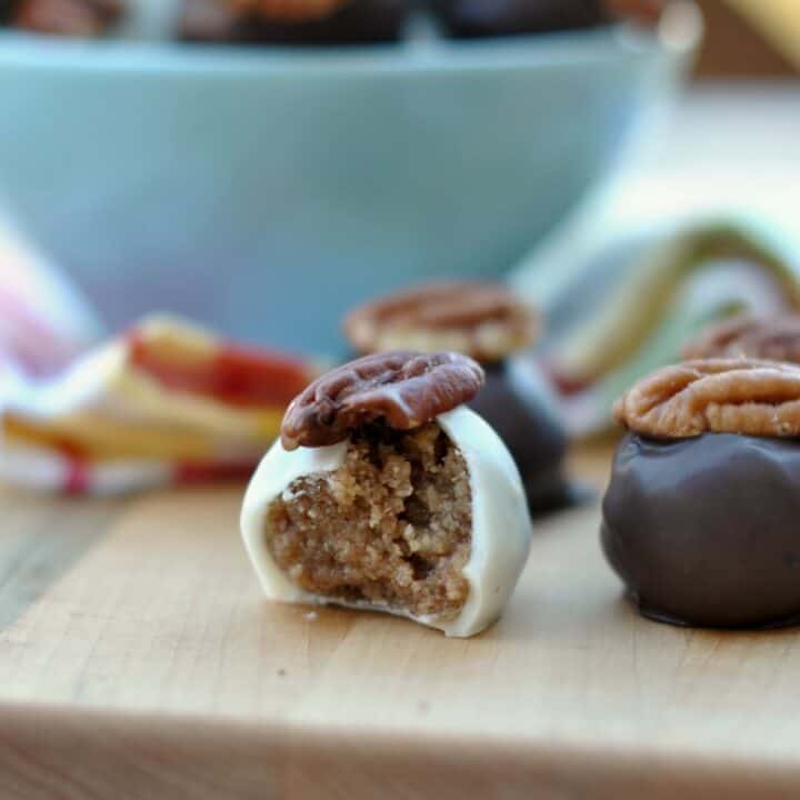 Pecan Pie truffles with pecans on top.