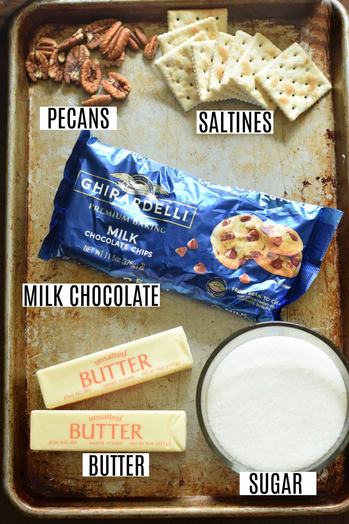 Ingredients needed to make cracker toffee, including butter, sugar, and saltines.