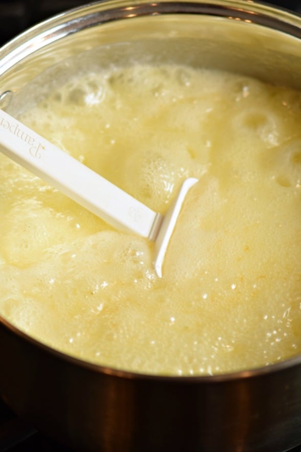 Fudge mixture in saucepan with rolling boil.