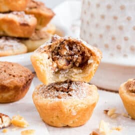 Pecan Tassies are tart-like cookies featuring the flavors and textures of pecan pie. Delicious, tender, buttery crust, crunchy pecans, and brown-sugar filling, all in one bite.