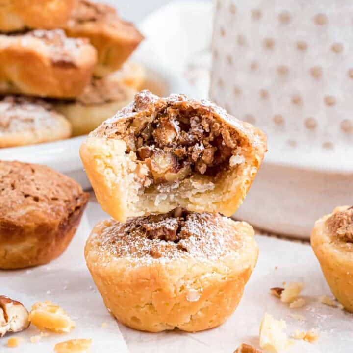 Pecan Tassies are tart-like cookies featuring the flavors and textures of pecan pie. Delicious, tender, buttery crust, crunchy pecans, and brown-sugar filling, all in one bite.