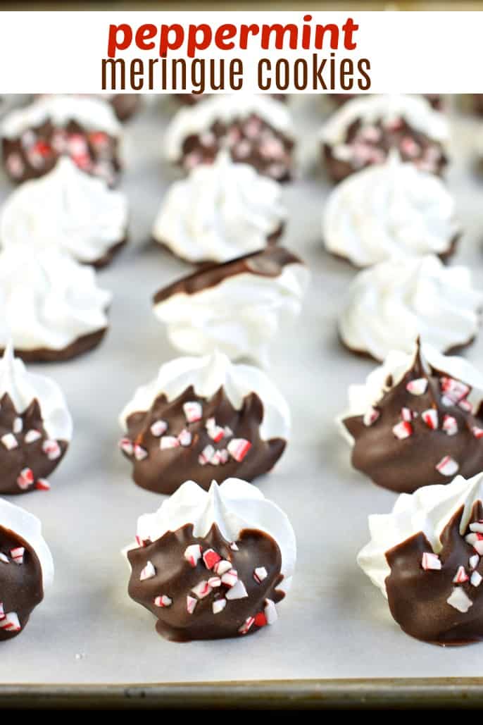 Peppermint Meringue Cookies dipped in dark chocolate with candy canes.