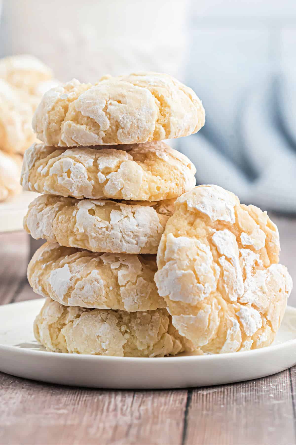Stack of butter cookies on white plate.