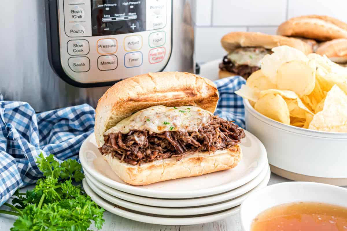 French dip sandwich with melted cheese.