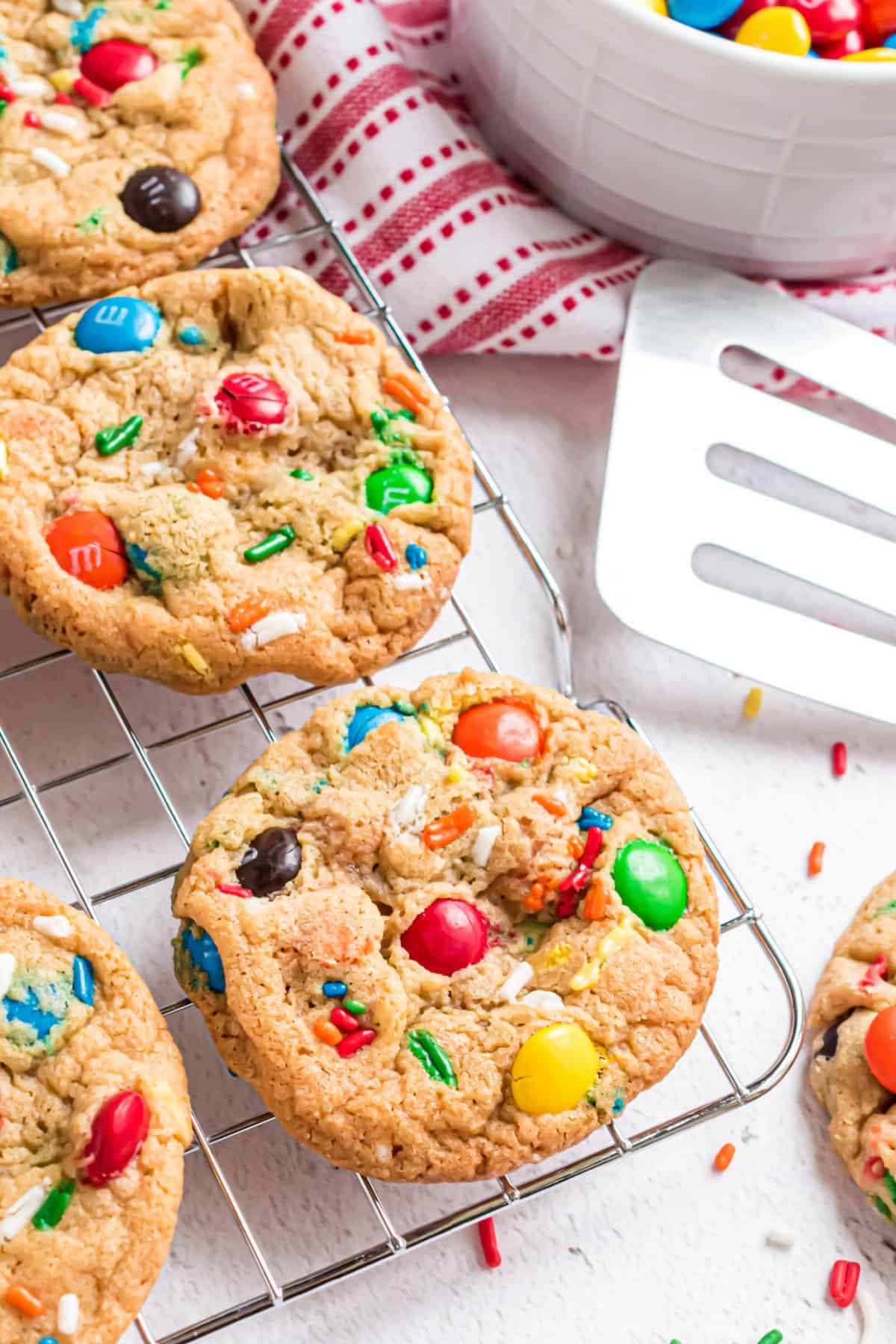 M&M pudding cookies on wire rack to cool.