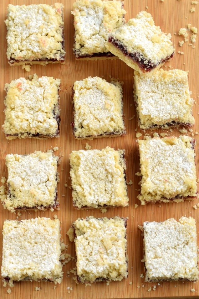 Raspberry cookie bars topped with powdered sugar.