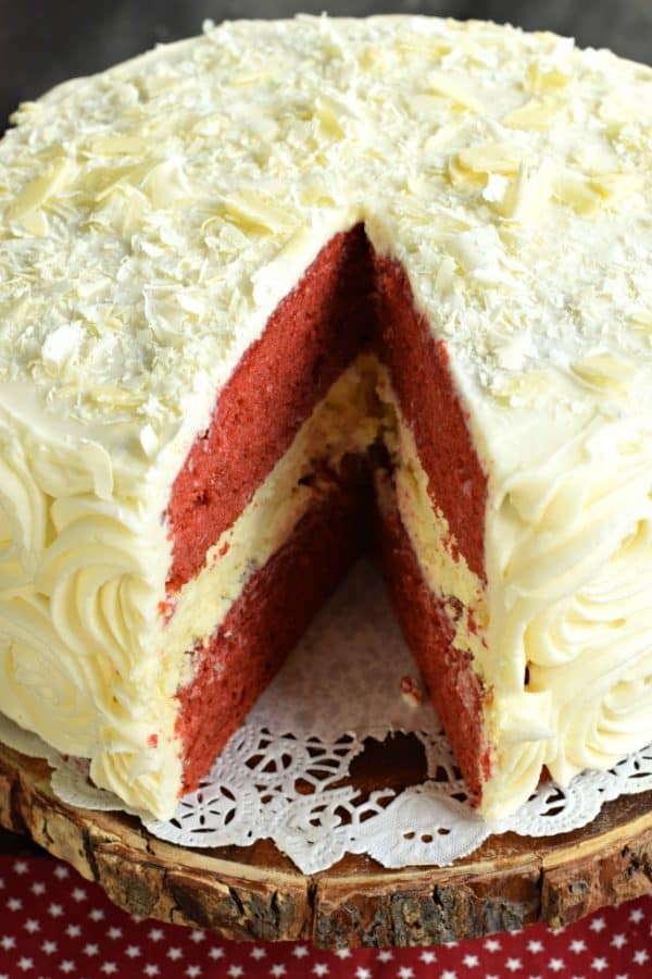The BEST Red Velvet Cheesecake Cake recipe starts with two layers of homemade red velvet cake with a layer of cheesecake in the middle. Topped with delicious cream cheese frosting.