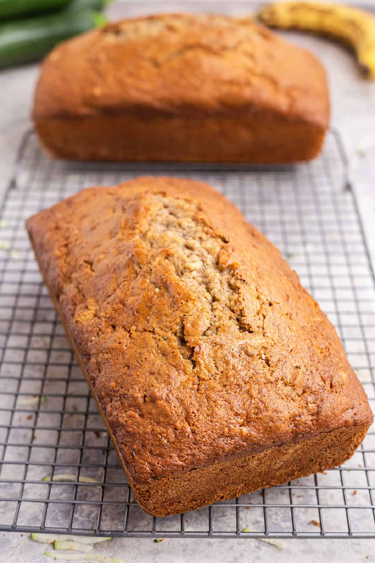 Zucchini banana bread on cooling rack.